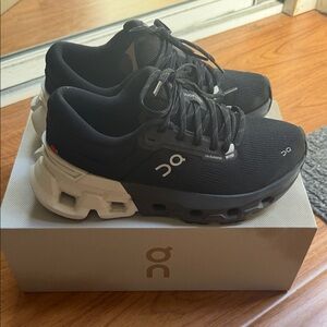 On Running Black and White Athletic Shoes